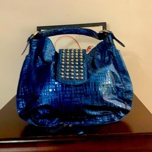 A royal blue handbag .